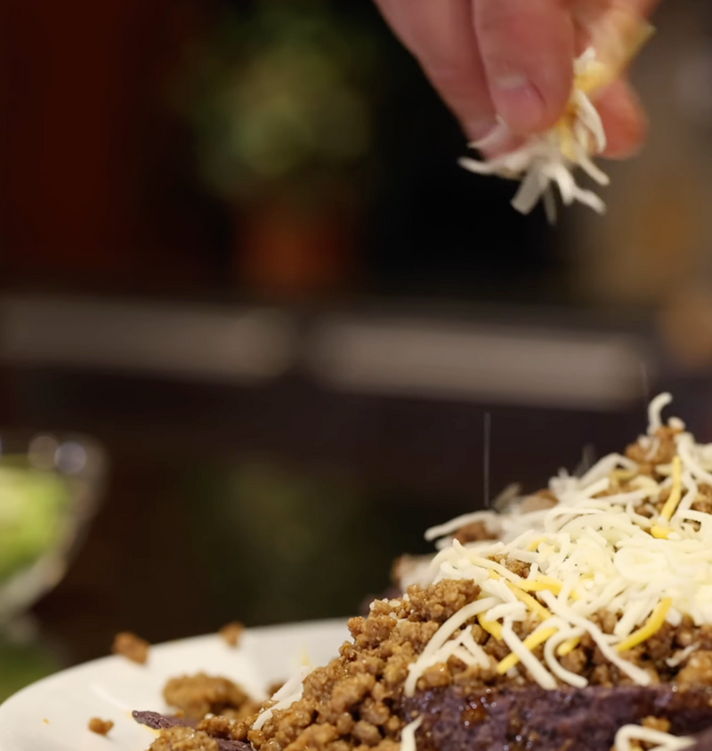 sprinkling cheese on buffalo