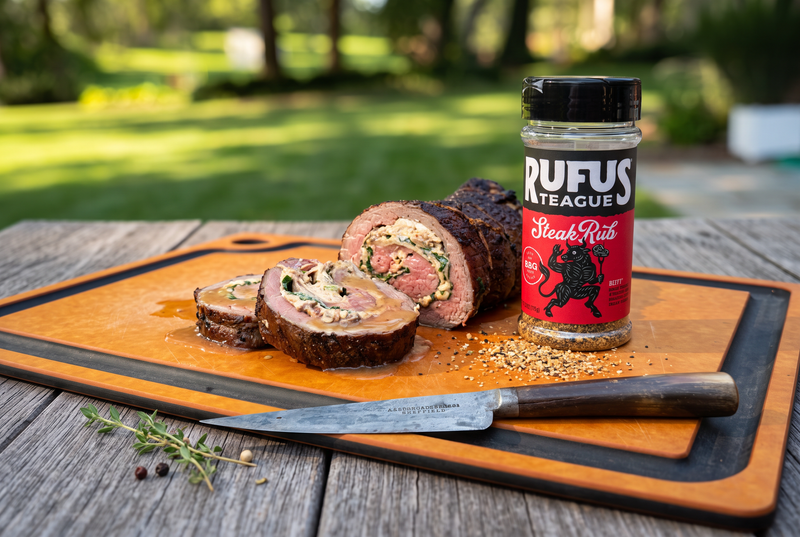 steak all rolled up with a knife and steak rub